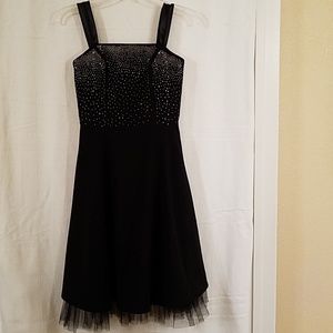 Classy dress. 58% rayon, 39% poly, 3% span